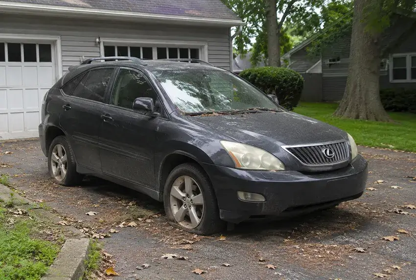 Unused vehicle parked in a residential driveway